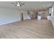 Spacious open-concept living room with recessed lighting, wood-look floors, and an adjacent kitchen at 104 Gin Branch Rd, Wendell, NC 27591