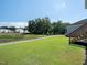 Sprawling backyard featuring a well-manicured lawn, steps, and a picturesque landscape with mature trees at 137 Shadowdale Ln, Rolesville, NC 27571