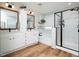 Bright bathroom featuring a double vanity, soaking tub, and luxurious glass shower enclosure at 137 Shadowdale Ln, Rolesville, NC 27571