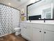 Well-lit bathroom with a dual vanity and framed mirror at 137 Shadowdale Ln, Rolesville, NC 27571