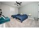 bedroom with two twin beds, striped accent wall, and lots of natural light at 137 Shadowdale Ln, Rolesville, NC 27571