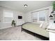Bright bedroom with neutral walls, a large window, and soft, natural lighting at 137 Shadowdale Ln, Rolesville, NC 27571