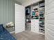 closet with custom shelving and storage organizers at 137 Shadowdale Ln, Rolesville, NC 27571