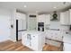Kitchen featuring a center island, white cabinetry, quartz countertops and stainless steel appliances at 137 Shadowdale Ln, Rolesville, NC 27571