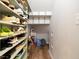 Walk-in storage area featuring built-in shelving units with plenty of shoe storage at 137 Shadowdale Ln, Rolesville, NC 27571