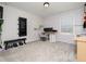 Workout room with weights, TV, desk and lots of natural light at 137 Shadowdale Ln, Rolesville, NC 27571