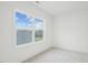 Bright bedroom with carpeted floor and large window offering natural light at 1429 Patchings Ln, Knightdale, NC 27545