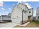 White two-story house with attached garage and landscaping at 1429 Patchings Ln, Knightdale, NC 27545