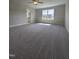 Bright bonus room with large windows, neutral carpet and view to ensuite bathroom at 7420 Prato Ct, Wendell, NC 27591