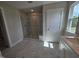 Shower with tile surround, glass door, and natural light from the bathroom window at 7420 Prato Ct, Wendell, NC 27591