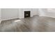 Comfortable living room with a fireplace, wood-look flooring, and plenty of natural light at 1301 Jasmine View Way, Knightdale, NC 27545