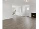 Spacious living room featuring a fireplace, wood-look floors, and neutral paint at 1301 Jasmine View Way, Knightdale, NC 27545