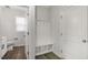 Convenient mud room with built-in bench and storage, next to a half bathroom at 1301 Jasmine View Way, Knightdale, NC 27545