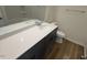 Clean bathroom with a combination of light and dark elements with a shower and tub combo at 29 Longdale Dr, Graham, NC 27253