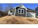 Charming one-story home featuring a gray exterior, white trim, and an attached one-car garage at 29 Longdale Dr, Graham, NC 27253