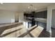 Modern kitchen featuring gray cabinets, white countertops, stainless steel appliances, and a center island at 29 Longdale Dr, Graham, NC 27253