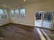 Bright living area with wood flooring and sliding glass doors leading to outdoor area at 29 Longdale Dr, Graham, NC 27253