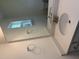 Bright bathroom featuring a large mirror over a speckled countertop and a pristine white sink at 135 Green Haven Blvd # 1, Youngsville, NC 27596