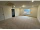 Spacious carpeted bedroom with a large window, recessed lighting, and neutral walls at 135 Green Haven Blvd # 1, Youngsville, NC 27596