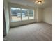 Bright bedroom with a large window overlooking the neighborhood at 135 Green Haven Blvd # 1, Youngsville, NC 27596