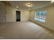 Bedroom featuring plush carpet, a closet, and a window that provides great outside views at 135 Green Haven Blvd # 1, Youngsville, NC 27596