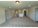 Expansive bonus room with carpeted flooring, multiple doorways, and abundant natural light at 135 Green Haven Blvd # 1, Youngsville, NC 27596