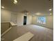 Large bonus room with neutral carpet, a window, recessed lights and a drop down attic access at 135 Green Haven Blvd # 1, Youngsville, NC 27596