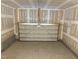 Spacious two-car garage with concrete flooring and an insulated sectional door at 135 Green Haven Blvd # 1, Youngsville, NC 27596