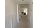 Hallway leading to living area with fireplace and staircase visible at 135 Green Haven Blvd # 1, Youngsville, NC 27596