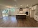Gourmet kitchen with large island, stainless steel appliances, and seamless access to the dining area at 135 Green Haven Blvd # 1, Youngsville, NC 27596