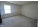 Unfinished room with bare walls, a large window, and raw flooring at 135 Green Haven Blvd # 1, Youngsville, NC 27596