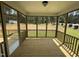 Relaxing screened porch with wooden flooring and view of the expansive green backyard at 135 Green Haven Blvd # 1, Youngsville, NC 27596