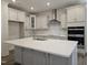 Bright kitchen featuring a large island, stainless steel appliances, and sleek cabinetry at 145 Green Haven Blvd # 83, Youngsville, NC 27596