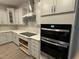 Modern kitchen boasts custom cabinets, marble backsplash, stainless steel appliances, and sleek countertops at 145 Green Haven Blvd # 83, Youngsville, NC 27596