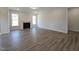 Spacious living room with fireplace, hardwood flooring, and ample natural light at 145 Green Haven Blvd # 83, Youngsville, NC 27596