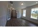Well-lit office space with glass doors and laminate wood flooring at 145 Green Haven Blvd # 83, Youngsville, NC 27596