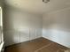 Well-lit room with wainscoting and wood-look flooring at 145 Green Haven Blvd # 83, Youngsville, NC 27596