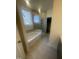 Elegant bathroom with soaking tub, shower, and tile flooring at 508 Glenwyck Ct, Fuquay Varina, NC 27526