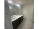 Double vanity bathroom with dark brown cabinets at 508 Glenwyck Ct, Fuquay Varina, NC 27526