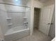 Bathroom with a tub, shower, and linen closet at 508 Glenwyck Ct, Fuquay Varina, NC 27526