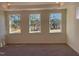 Bright bedroom with neutral carpeting and three windows at 508 Glenwyck Ct, Fuquay Varina, NC 27526
