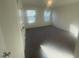 Spacious bedroom with neutral carpeting and two large windows at 508 Glenwyck Ct, Fuquay Varina, NC 27526