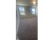 Bright bedroom with two windows and gray carpeting at 508 Glenwyck Ct, Fuquay Varina, NC 27526