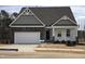 Two-story house with gray siding, stone accents, and a front porch at 508 Glenwyck Ct, Fuquay Varina, NC 27526