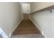 Elegant wooden staircase leading to the upper level at 508 Glenwyck Ct, Fuquay Varina, NC 27526