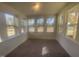 Bright sunroom with multiple windows offering scenic views at 508 Glenwyck Ct, Fuquay Varina, NC 27526