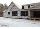 Rear view of house under construction, large windows, house wrap at 1207 Red Cedar Court, Youngsville, NC 27596
