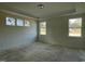Spacious bedroom with tray ceiling and ample natural light from large windows at 1504 Maelyn Way, Fuquay Varina, NC 27526