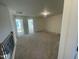 Spacious bonus room with neutral carpet, upper floor location, and staircase with nice railings at 1504 Maelyn Way, Fuquay Varina, NC 27526