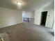 A large, bright bonus room with neutral carpet located on an upper floor near a staircase and bedroom entrances at 1504 Maelyn Way, Fuquay Varina, NC 27526